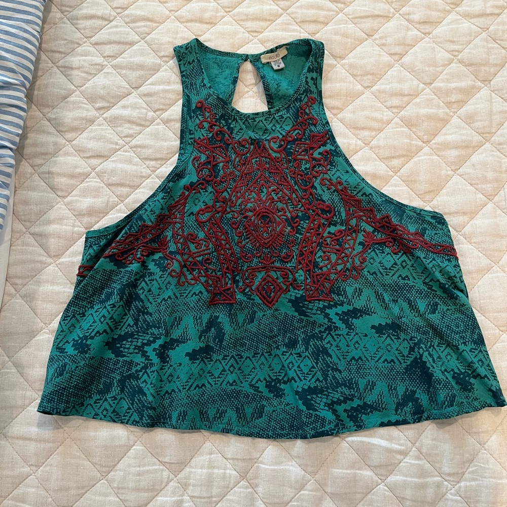 Teal crop top with red stitching